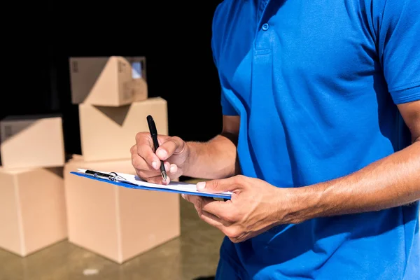 depositphotos_164829186-stock-photo-delivery-man-with-documents